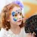 Michigan fan Emma Arsulowicz, 6, of Grand Rapids, checks out her face paint before a the Michigan Alumni pep rally at the Renaissance Atlanta Waverly Hotel in Atlanta on Friday, April 5, 2015. Melanie Maxwell I AnnArbor.com